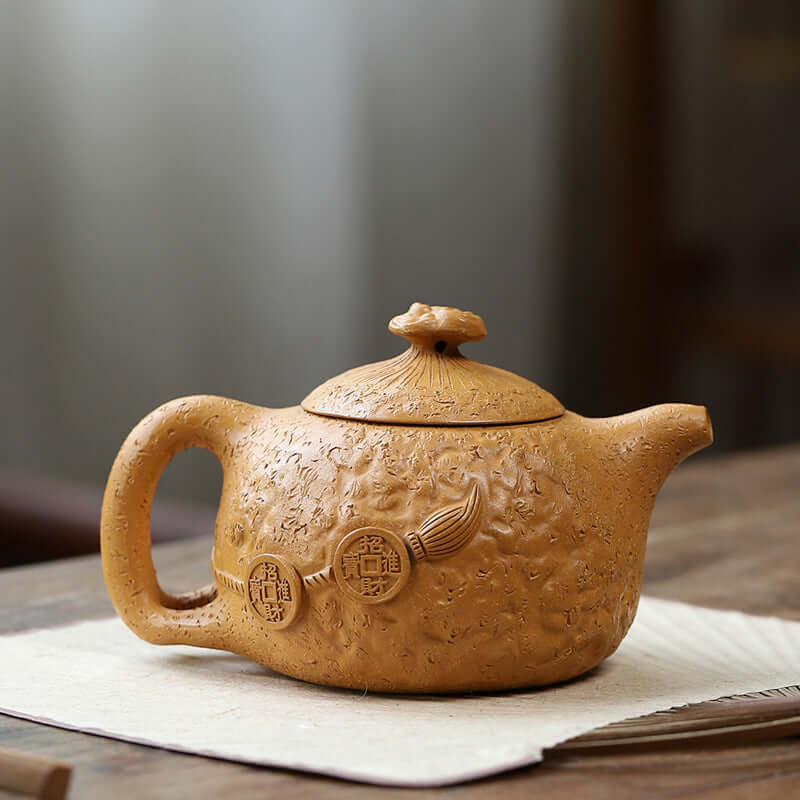 Handmade Yixing purple sand teapot with unique texture and lid design, showcasing traditional craftsmanship and elegance.