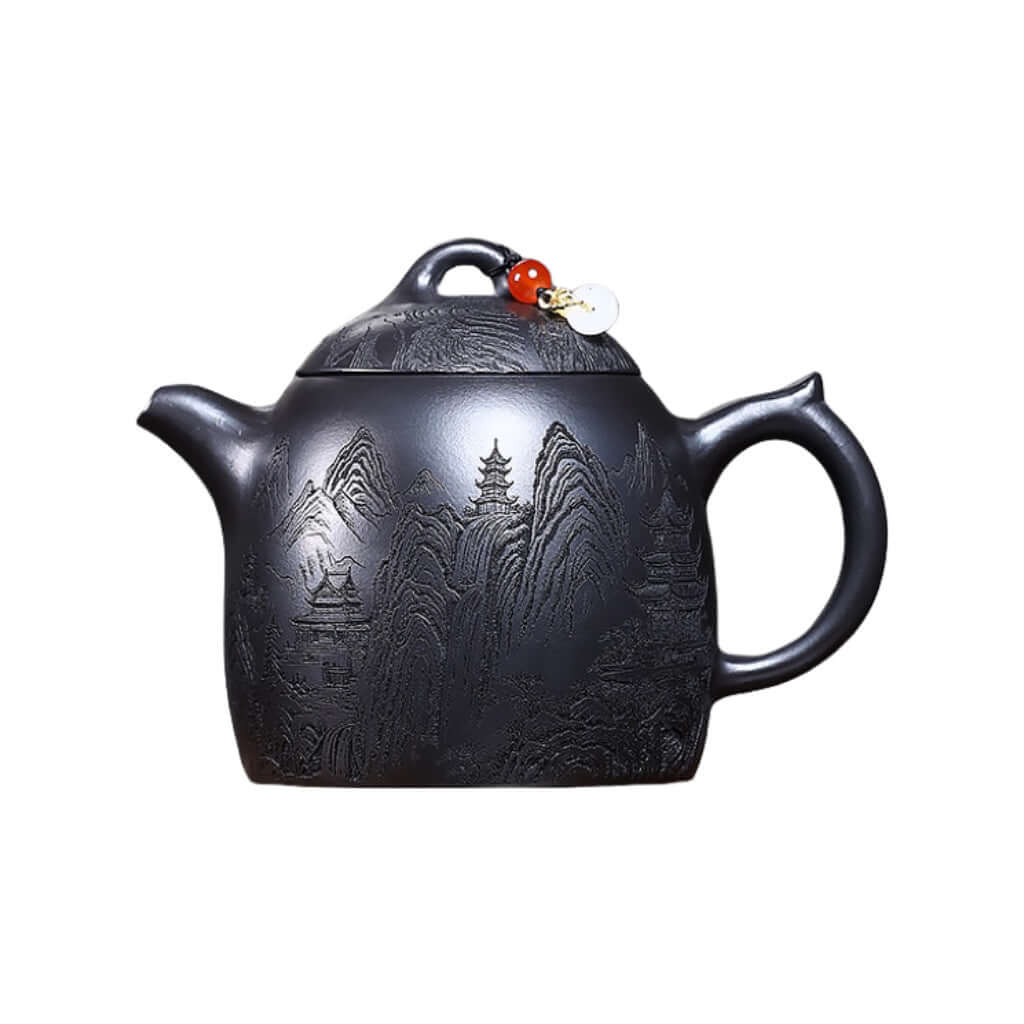 Handmade Yixing purple sand teapot featuring intricate mountain designs, perfect for Kung Fu tea sets.
