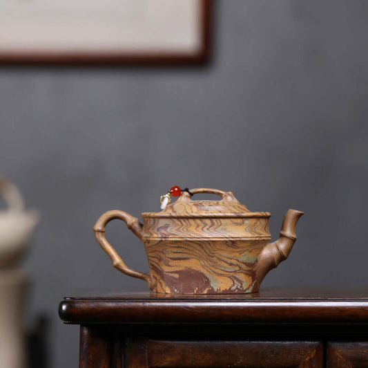 Handmade Yixing purple sand teapot with intricate twisted mud design, perfect for Kung Fu tea set enthusiasts.