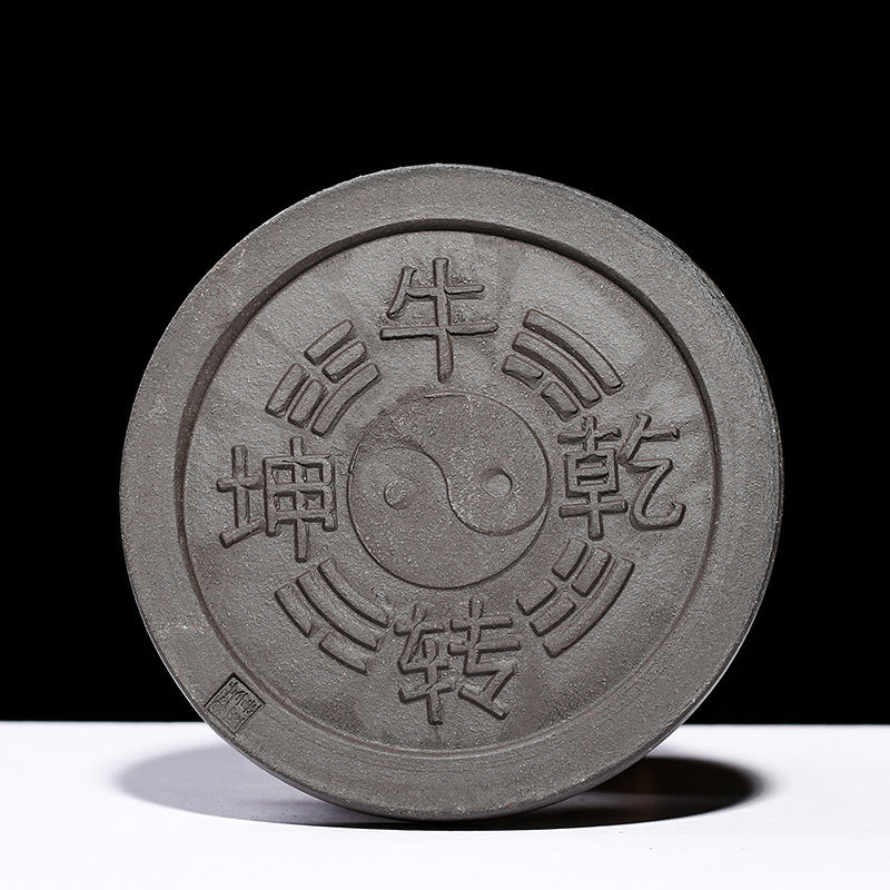 Handmade Yixing purple sand tea pet with yin-yang design, symbolizing luck and harmony for tea lovers.
