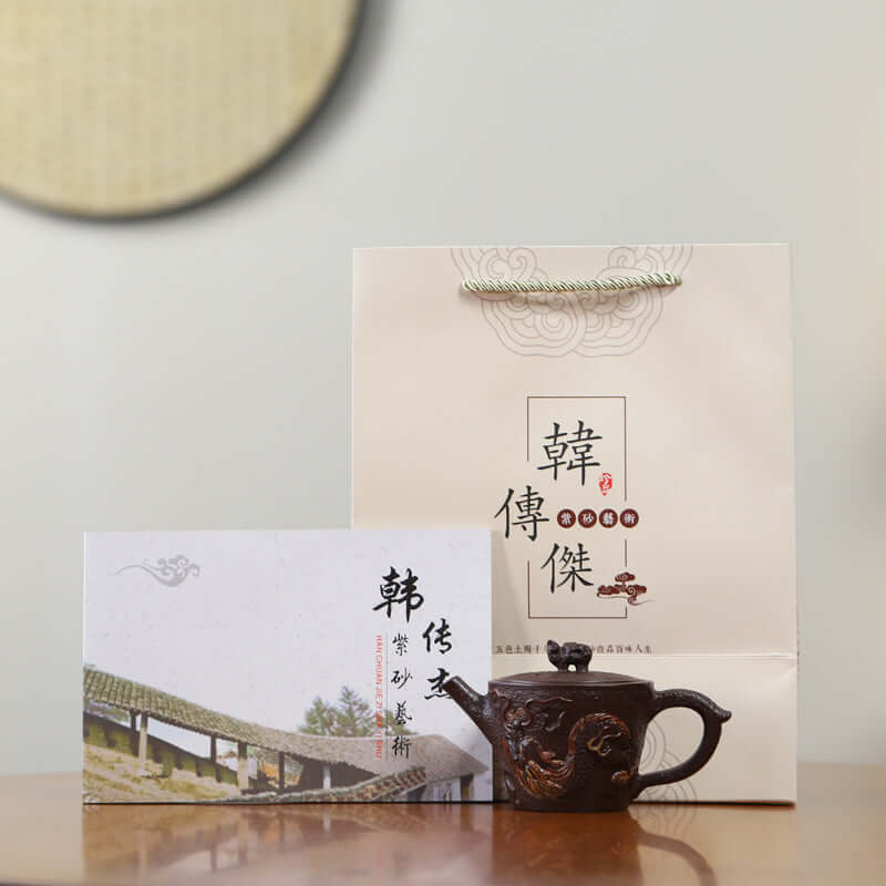 Handmade Yixing purple sand teapot with gift packaging and certificate from craftsman Han Chuanjie.