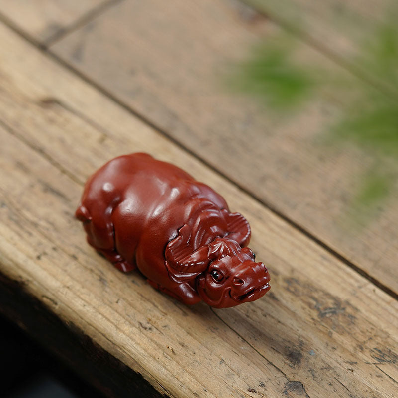 Handmade Yixing purple sand tea pet in the shape of a cattle, perfect for tea play and home decoration.
