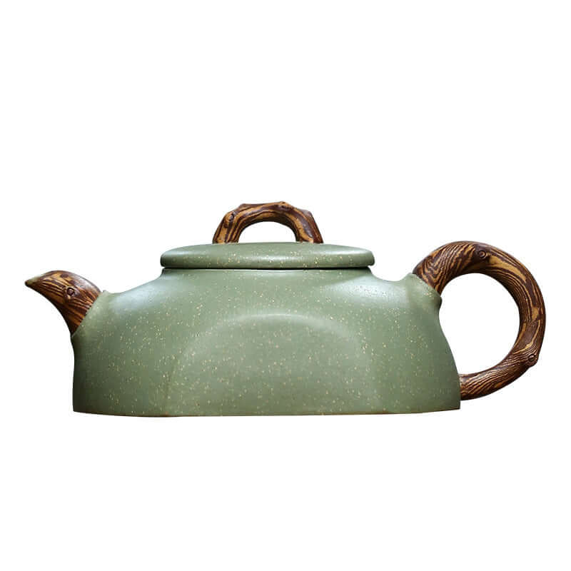Handmade Yixing purple sand teapot in green, featuring a natural wood-like handle and elegant design.