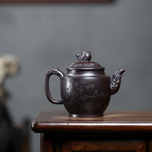 Handmade Yixing purple sand teapot with intricate floral design, showcasing traditional craftsmanship for kung fu tea.