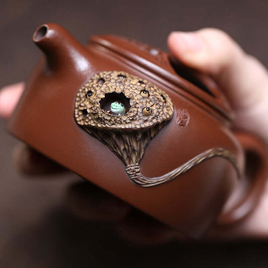 Handmade Yixing purple sand teapot featuring unique frog lotus seed design, perfect for kung fu tea set.