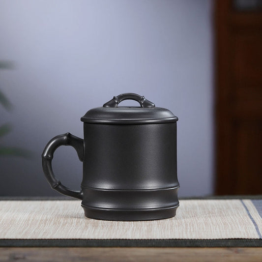 Handmade Yixing purple sand lidded cup featuring bamboo design, perfect for tea brewing with large capacity.