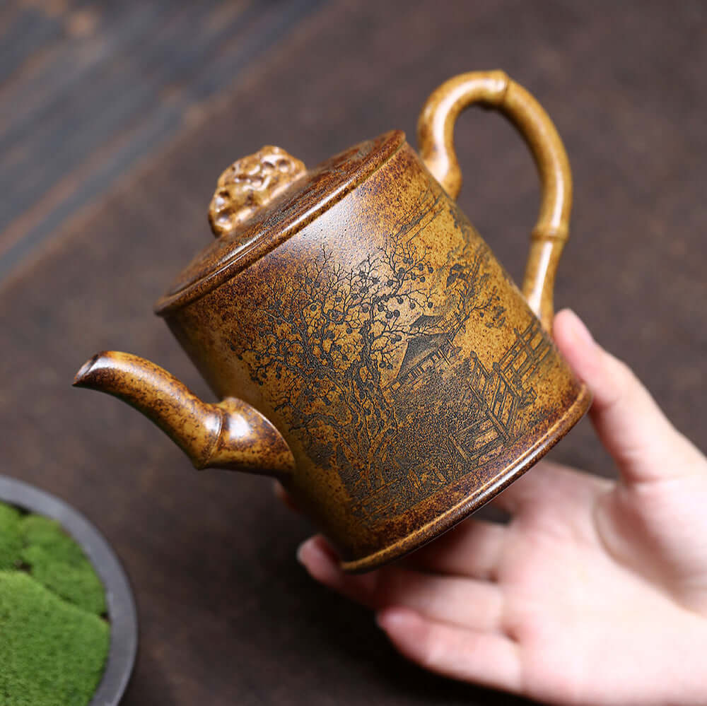 Handmade Yixing purple sand teapot with intricate design, perfect for kung fu tea sets and tea ceremonies.