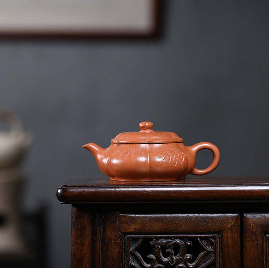 Handmade Yixing purple sand teapot with a pumpkin shape, perfect for kung fu tea ceremonies.