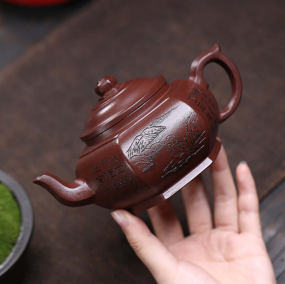 Handmade Yixing purple sand teapot with intricate engravings, perfect for kung fu tea set enthusiasts.