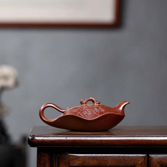 Handmade Yixing purple sand teapot showcasing ancient craftsmanship, ideal for tea enthusiasts and collectors.