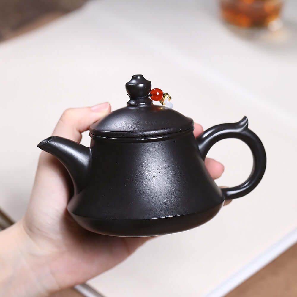 Handmade Yixing purple sand teapot showcasing original craftsmanship with unique design for tea lovers.