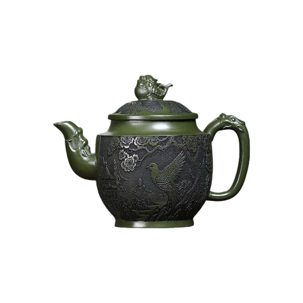 Handmade Yixing purple sand teapot with green clay carving, featuring flower and bird designs, perfect for Kung Fu tea sets.