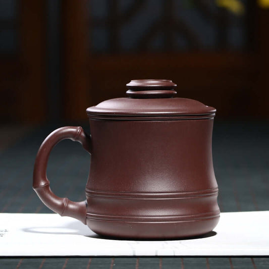 Handmade Yixing purple sand teapot in rich brown, showcasing unique craftsmanship and traditional design.