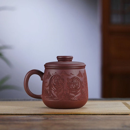 Handmade Yixing purple sand cup featuring engraved tigers, perfect for tea lovers and a unique office gift.