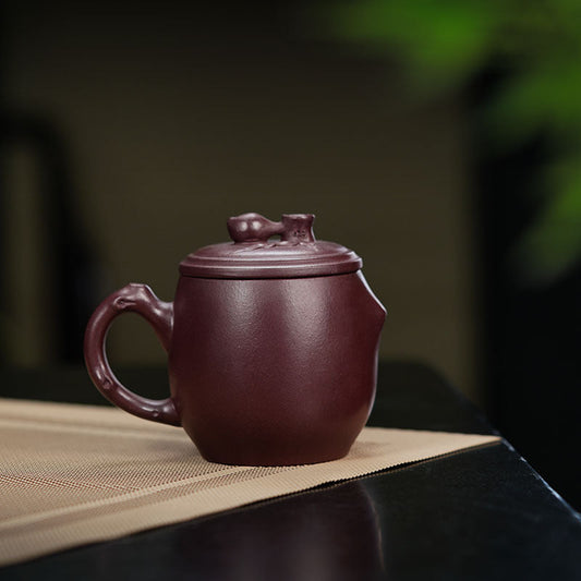 Handmade Yixing purple sand teapot showcasing artisan craftsmanship, ideal for tea enthusiasts and commercial use.