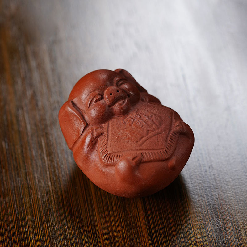 Handmade Yixing purple sand pig sculpture, crafted by Yixing artisans, perfect for tea play and decoration.