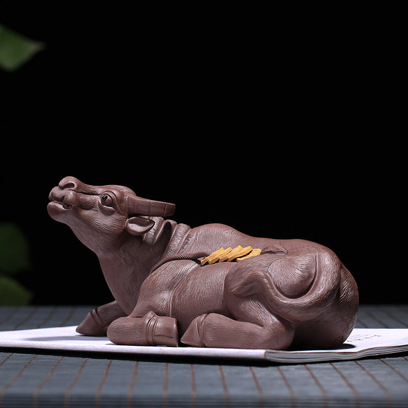Handmade Yixing purple sand cattle tea pet, symbolizing wealth and good fortune, perfect for tea ceremony decoration.