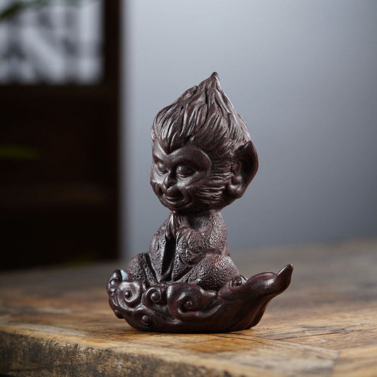 Handmade Chinese-style Sun Wukong ornament in Yixing purple sand, perfect for tea lovers and desktop decor.