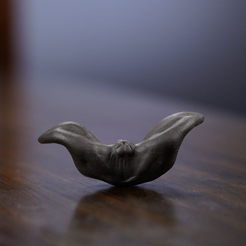 Handmade Yixing purple sand tea pet sculpture, unique tea accessory for tea lovers, showcasing fine craftsmanship.
