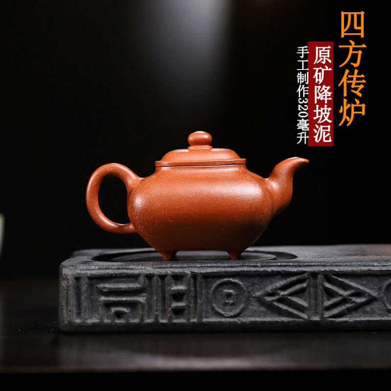 Handmade Yixing purple sand teapot on a display stand, showcasing authentic craftsmanship and unique design.