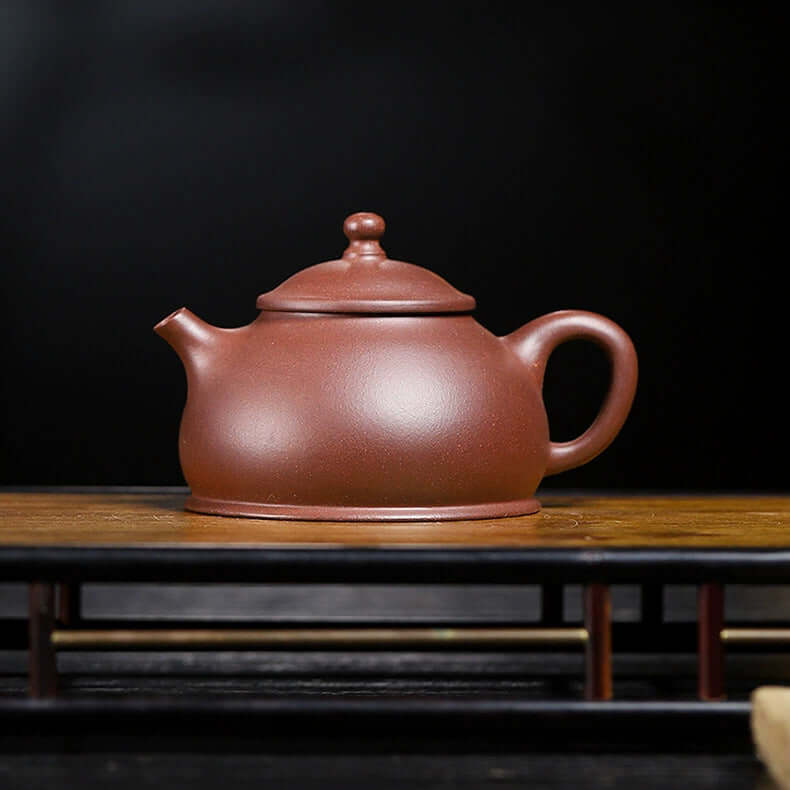 Handmade Yixing purple sand teapot, crafted from original purple clay, perfect for tea enthusiasts.