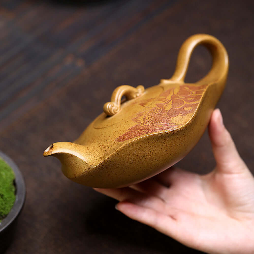 Handmade Yixing purple sand teapot with intricate design, ideal for home kung fu tea sets.