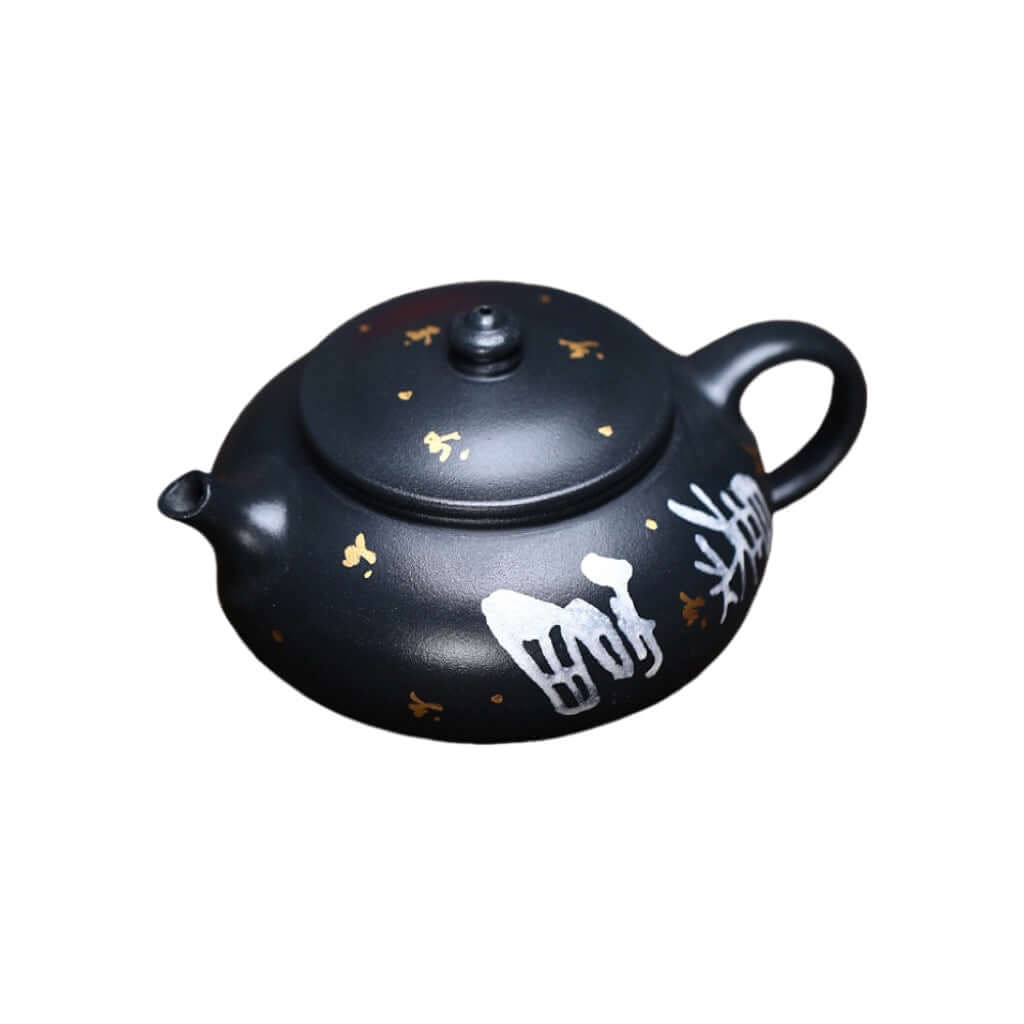 Handmade Yixing purple sand teapot with delicate gold detailing, perfect for Kung Fu tea set.