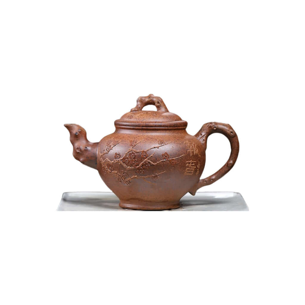 Handmade Yixing purple sand teapot with plum blossom design, perfect for home kung fu tea set.