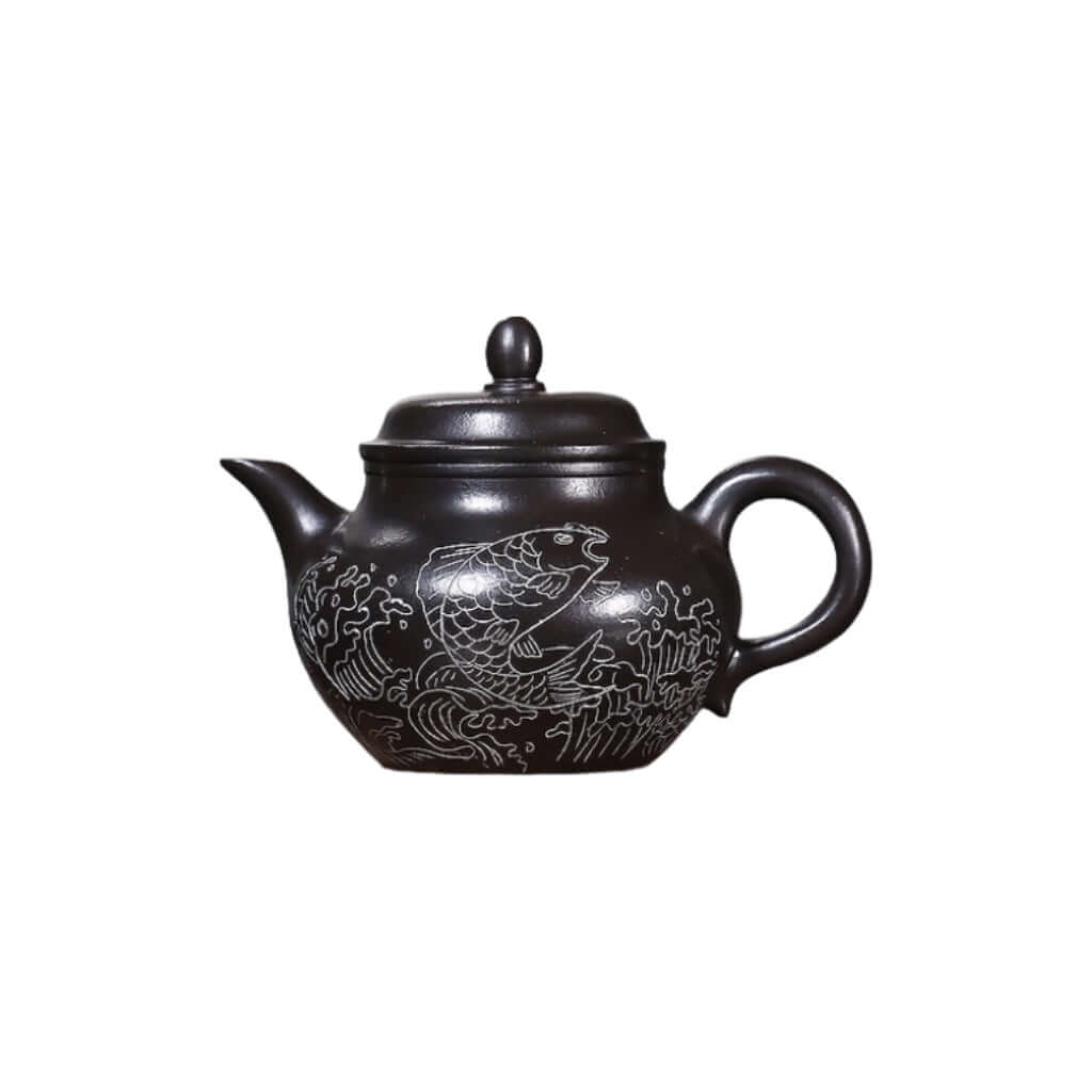 Handmade Yixing purple sand teapot featuring fish design, perfect for kung fu tea sets, original craftsmanship.