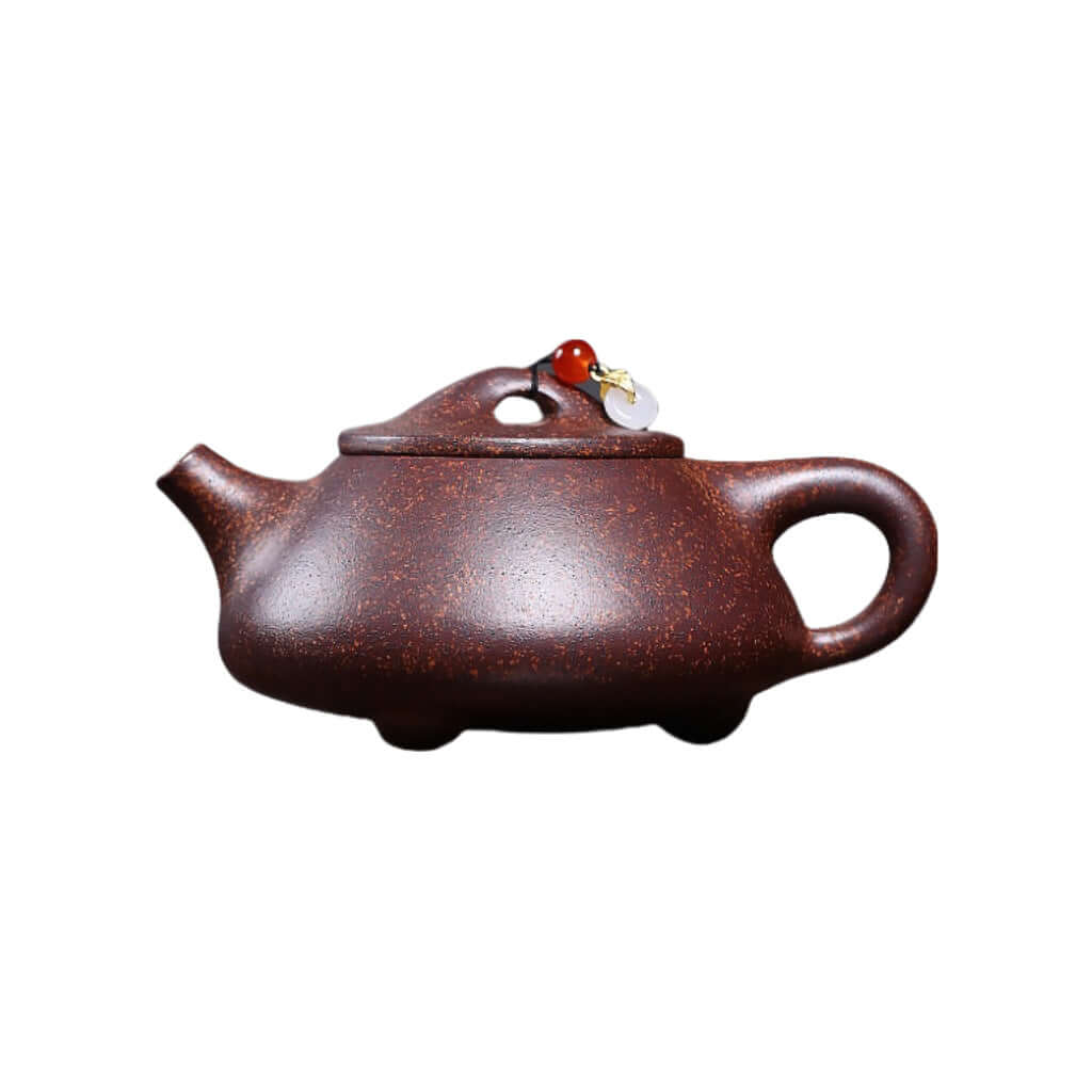Handmade Yixing purple sand teapot featuring original Tianxing mud and a stone scoop, ideal for Kung Fu tea sets.
