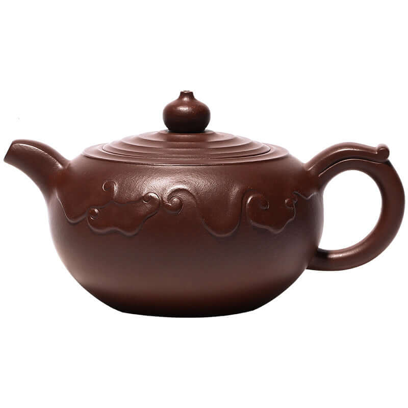 Handmade Yixing purple sand teapot featuring intricate cloud patterns and a traditional design.