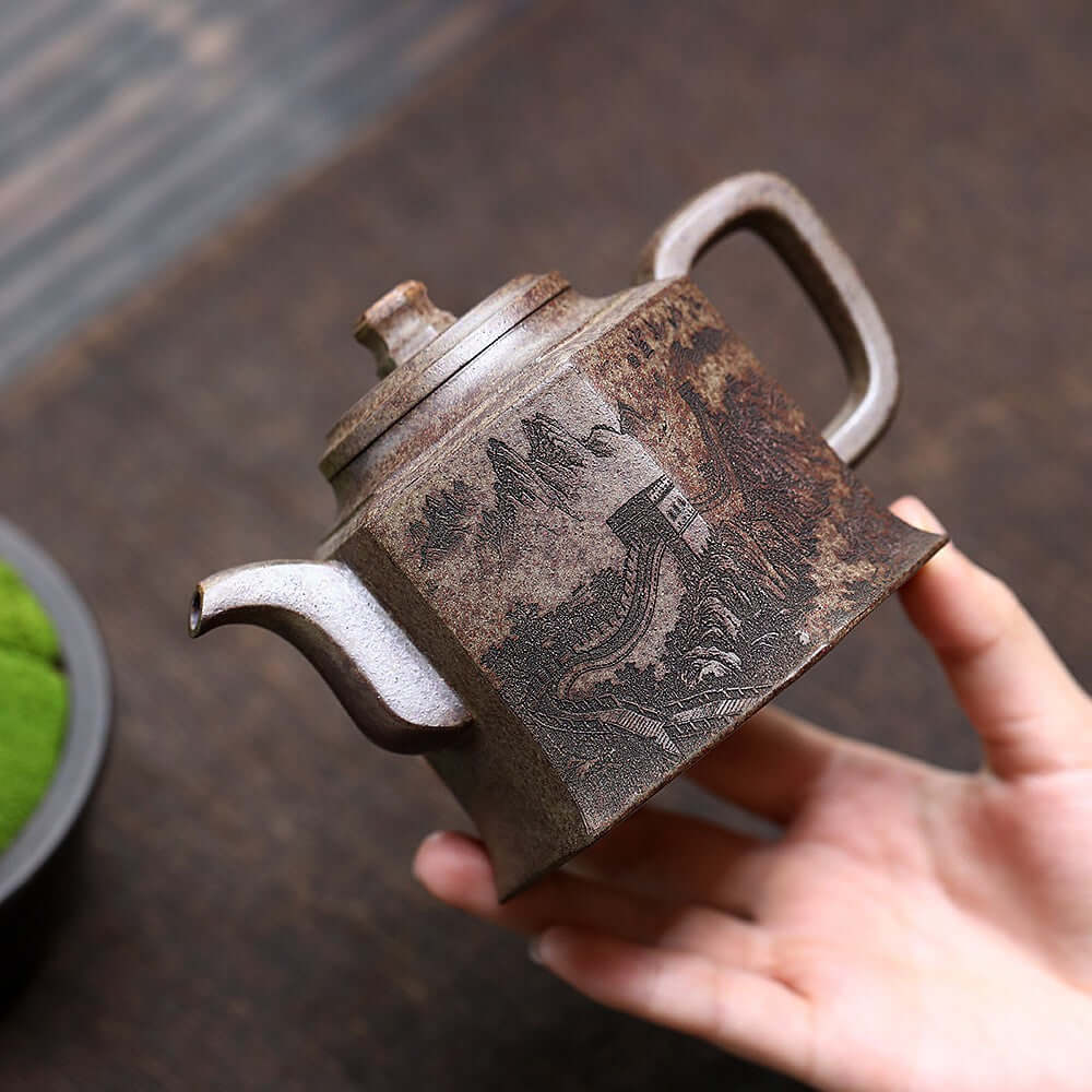 Handmade Yixing purple sand teapot with intricate mountain design, perfect for Kung Fu tea sets.