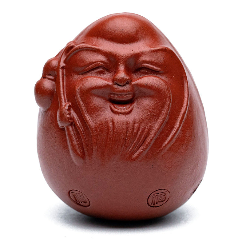 Handmade Yixing purple sand tea pet egg ornament, a unique gift ideal for tea lovers and collectors.