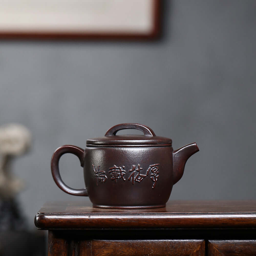 Handmade Yixing purple sand teapot, crafted by Yixing artisans, featuring original clay and elegant design.