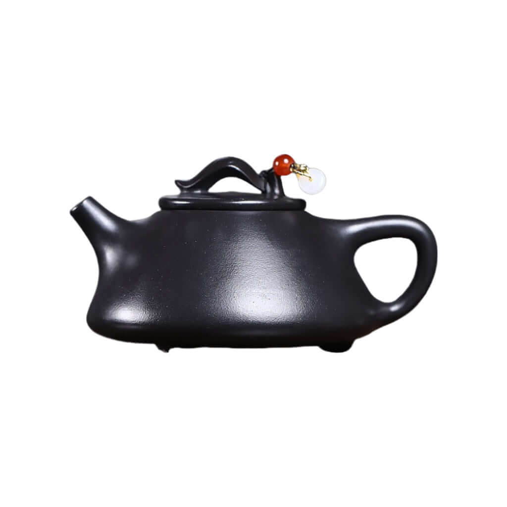 Handmade Yixing purple sand teapot with unique design, perfect for Kung Fu tea brewing and home decoration.
