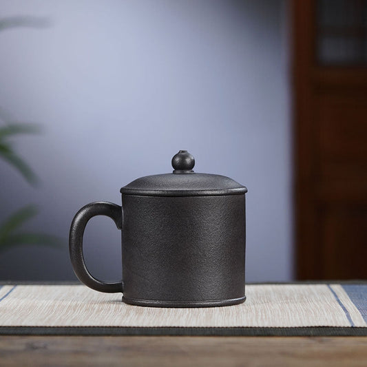 Handmade Yixing purple sand tea cup with lid, ideal for tea lovers and perfect for gifting.