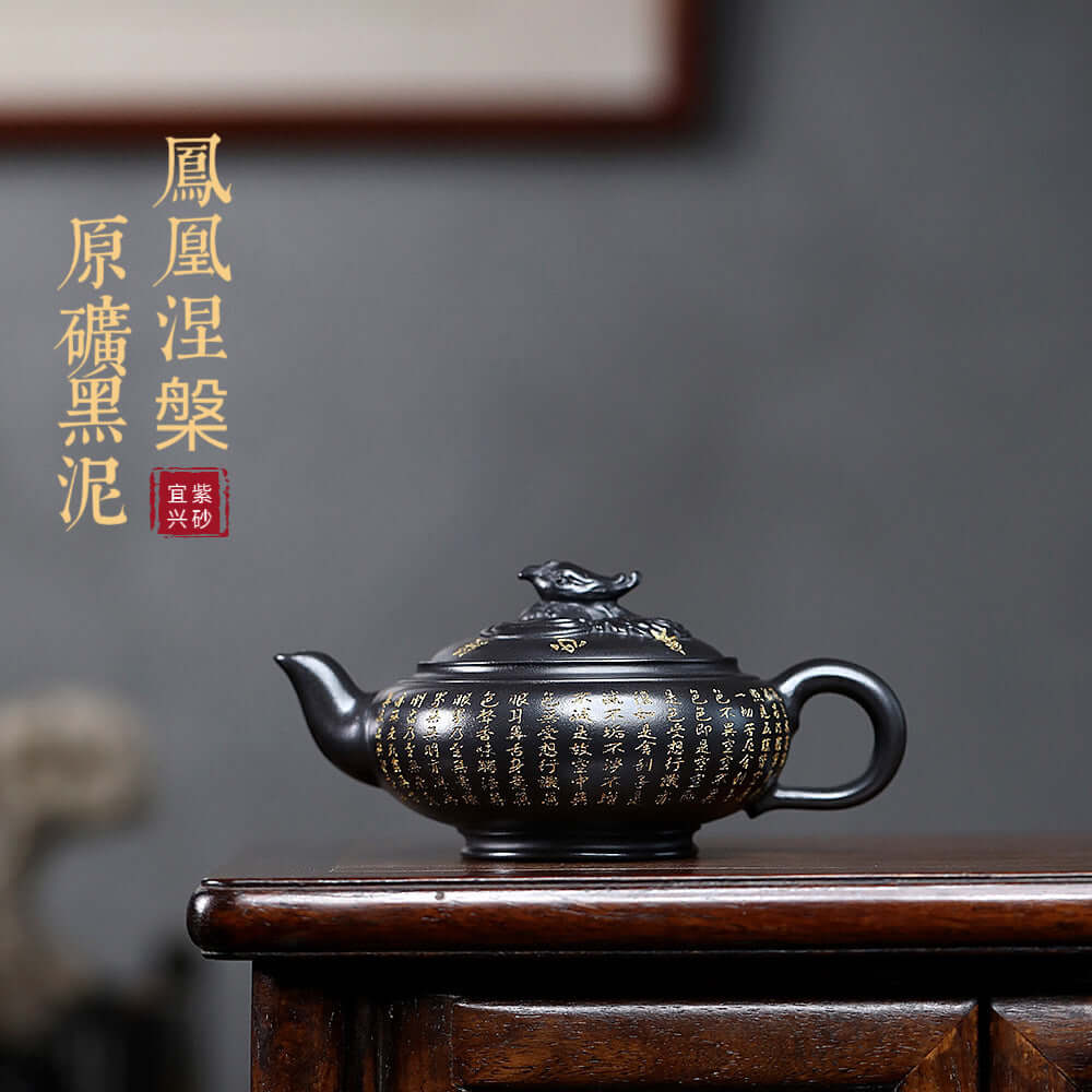 Handmade Yixing purple sand teapot in black mud, featuring intricate designs, ideal for tea enthusiasts.