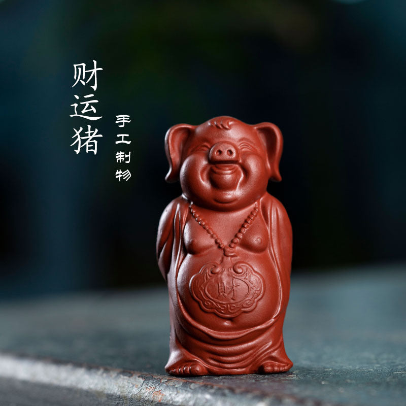 Handmade Yixing purple sand pig sculpture, also known as Bajie, ideal for tea table decor and collectibles.