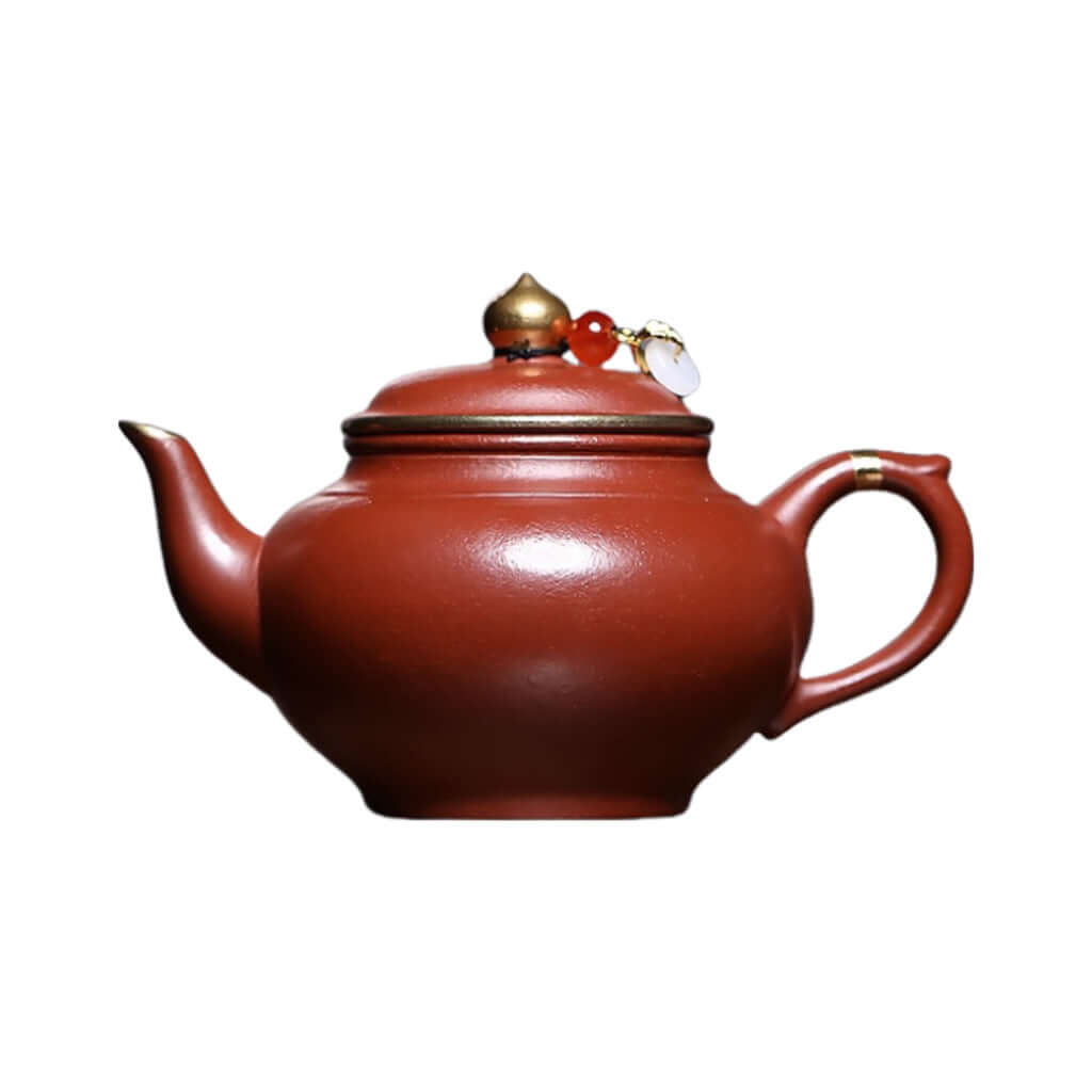 Handmade Yixing purple sand teapot with mineral wrinkled surface and gold inlay, perfect for Kung Fu tea sets.