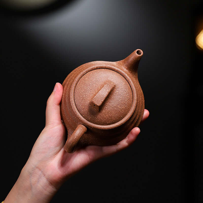 Handmade Yixing purple sand teapot, showcasing its unique design and texture, perfect for kung fu tea ceremonies.