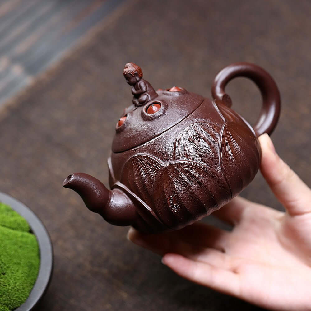 Handmade Yixing purple sand teapot with lotus design, crafted from original purple clay for kung fu tea sets.