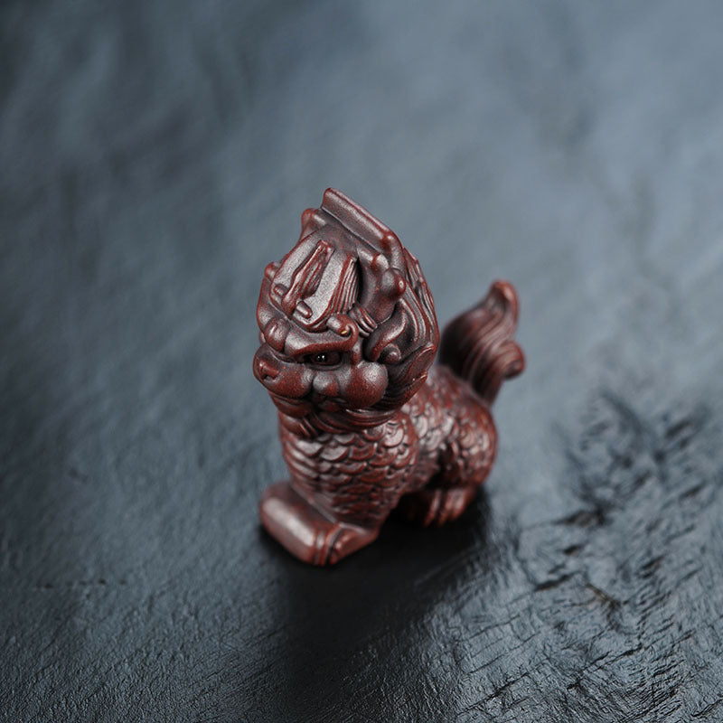 Handmade Yixing purple sand Kirin decoration, showcasing original craftsmanship, perfect for tea lovers and home decor.