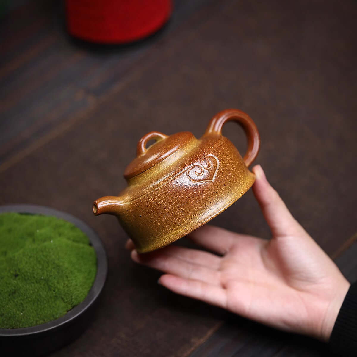 Handmade Yixing purple sand teapot, showcasing traditional craftsmanship and unique design, perfect for tea enthusiasts.