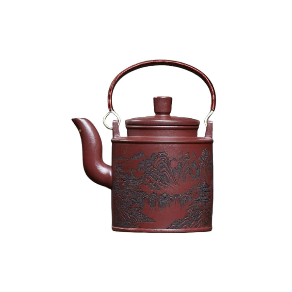 Handmade Yixing purple sand teapot with mountain scenery, perfect for kung fu tea sets and crafted by Yixing artisans.