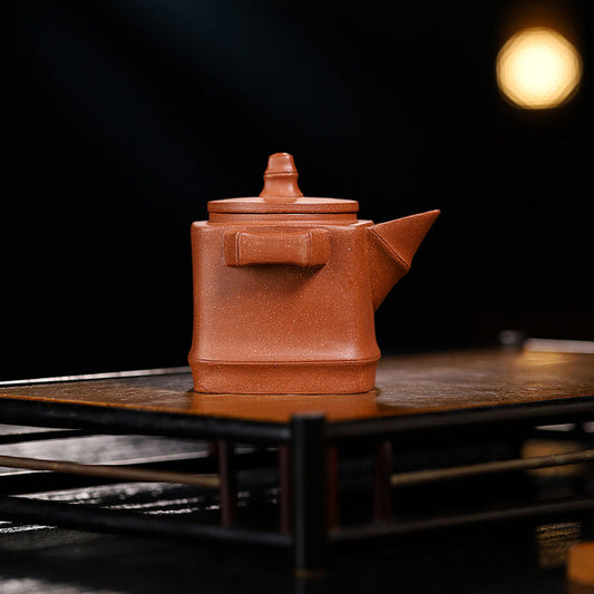 Handmade Yixing purple sand teapot with a unique square shape, perfect for Kung Fu tea ceremonies.