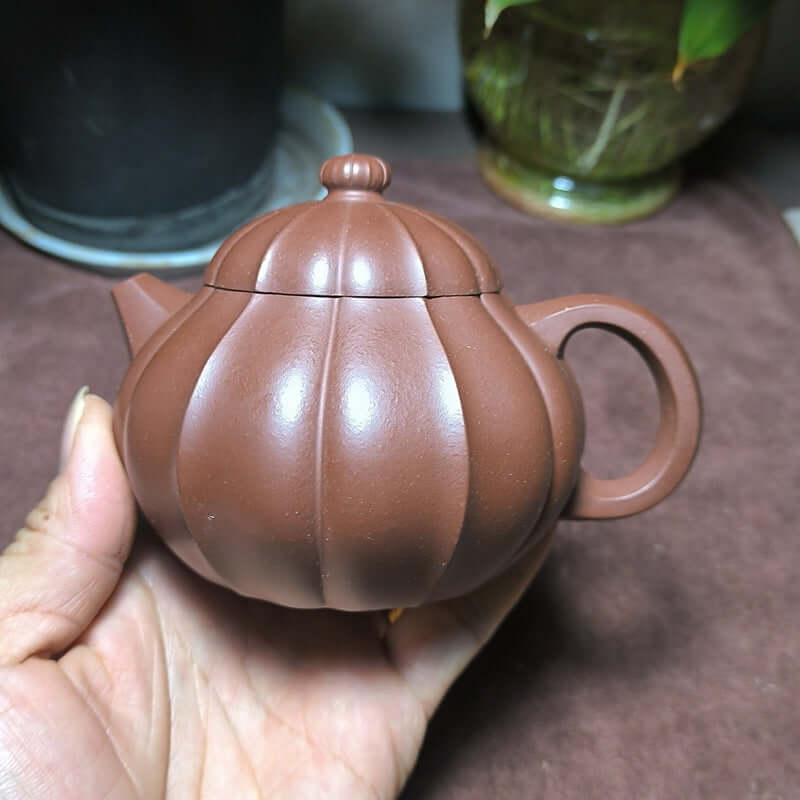 Handmade Yixing purple sand teapot, original purple sand, unique pumpkin shape, perfect for tea enthusiasts.