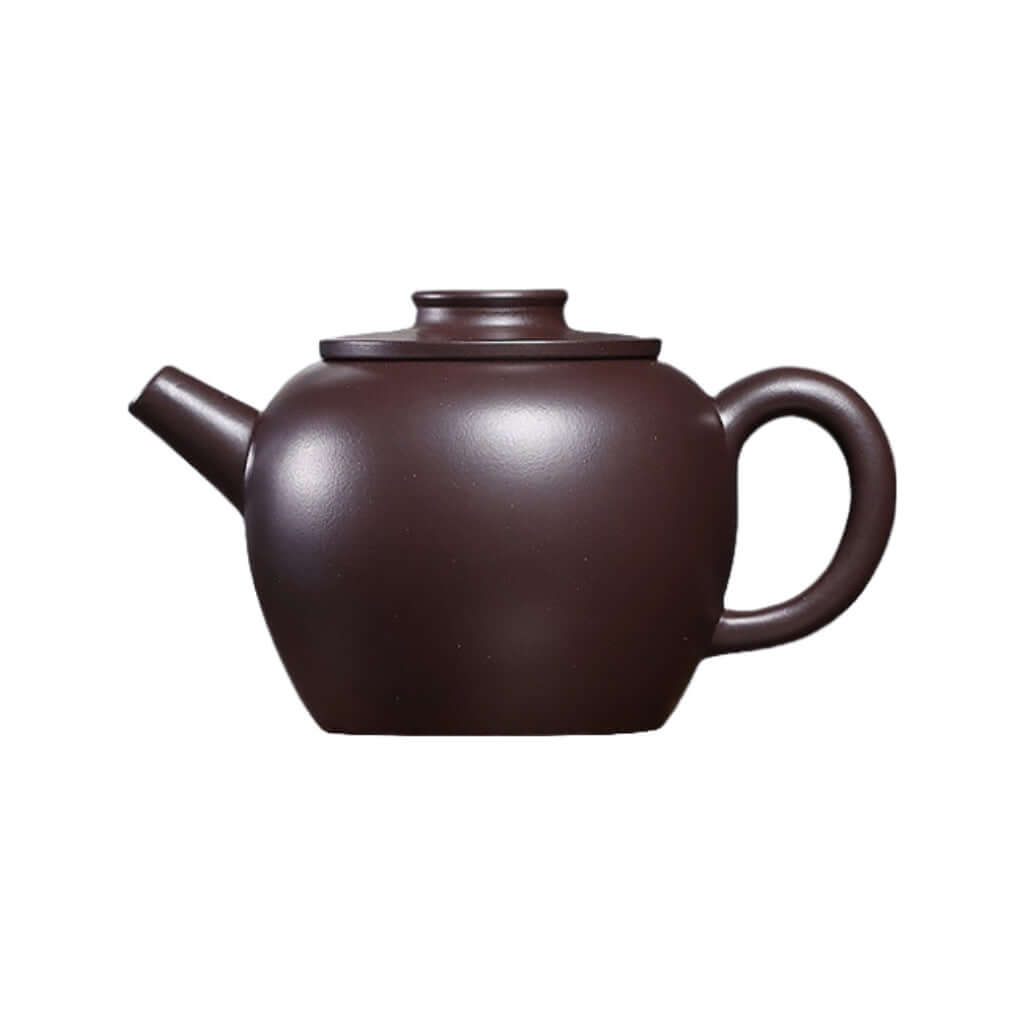 Handmade Yixing purple sand teapot with a classic flat lid, perfect for Kung Fu tea ceremonies.