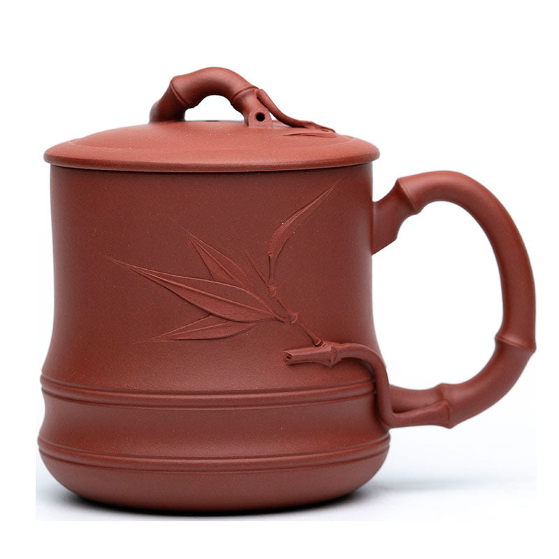 Handmade Yixing purple sand cup with bamboo cover, perfect for tea lovers and authentic craftsmanship.