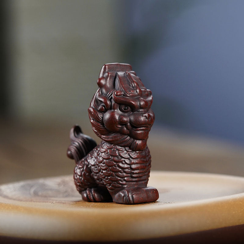 Handmade Yixing purple sand Kirin decoration for home or office, ideal for tea lovers and collectors.