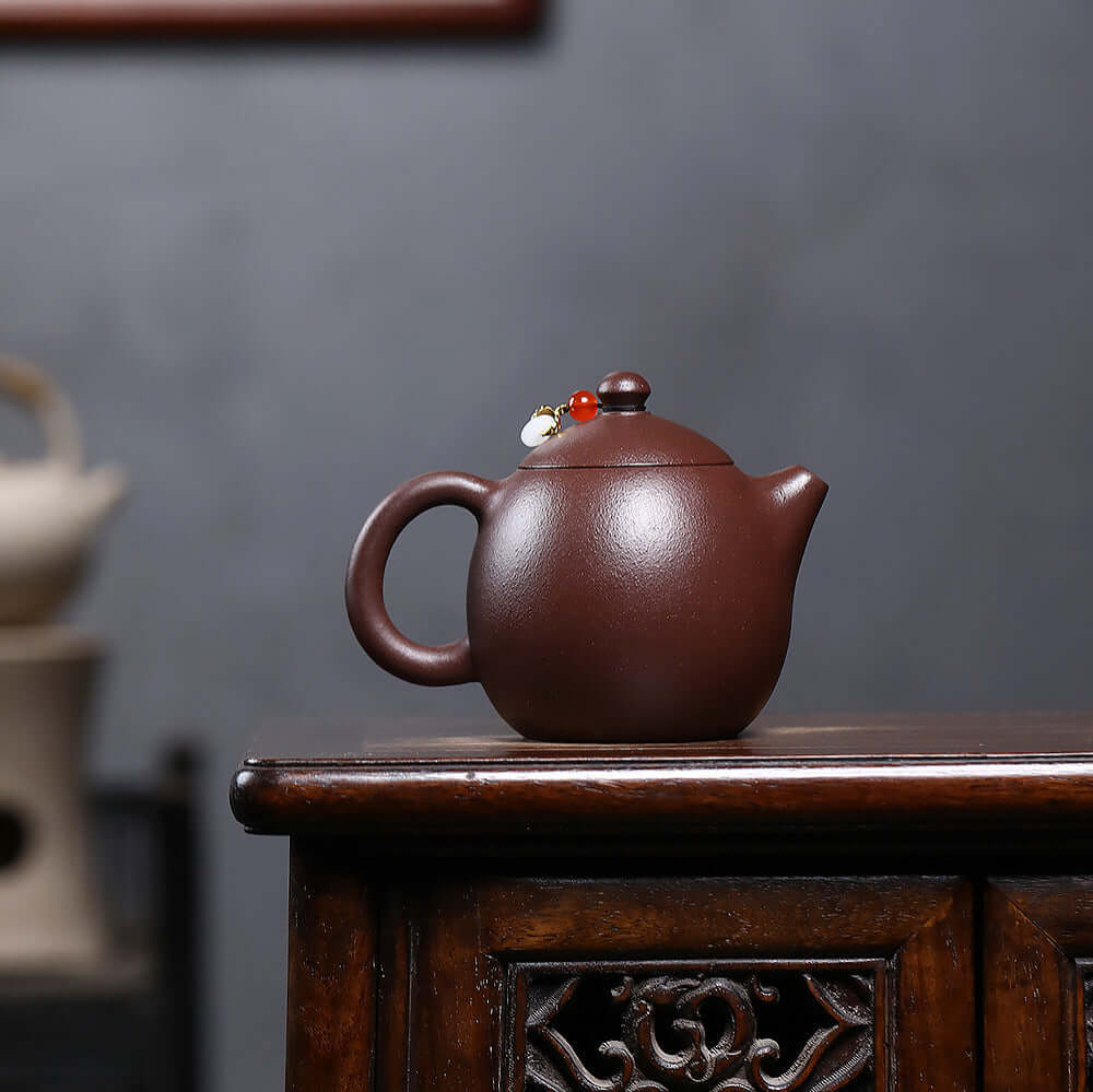 Handmade Yixing purple sand teapot, original design, crafted by Yixing artisans, perfect for Kung Fu tea ceremonies.